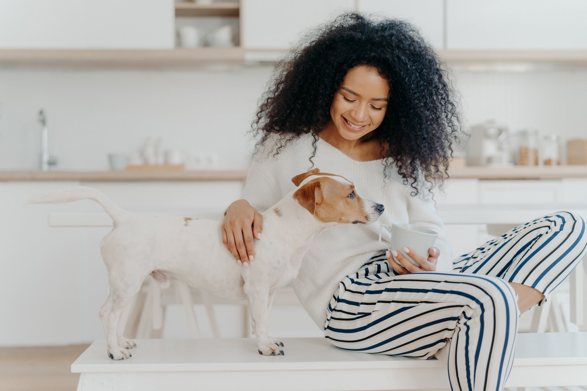 Woman with Pet Dog at Home